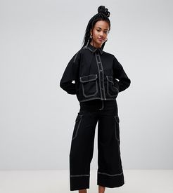 wide leg cargo pants with pockets in black with contrast stitching