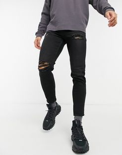 tapered jeans with rips in black
