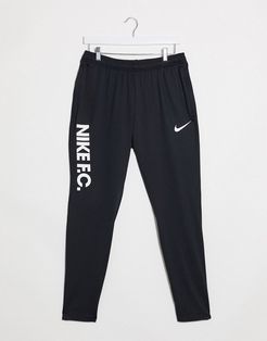 Nike Soccer FC logo sweatpants in black
