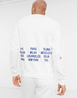 World Tour Pack graphic crew neck sweatshirt in white