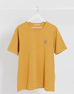 Co Uno circle logo t-shirt in mustard yellow