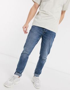 slim fit distressed jeans in light blue