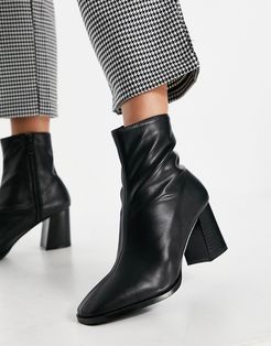 Freya heeled ankle boots in black faux leather