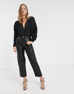 draped bodysuit with embellished shoulder pads in black