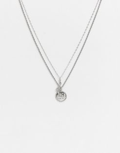 layered necklace in silver with snake and coin pendants