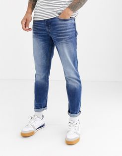 slim jeans in mid wash blue