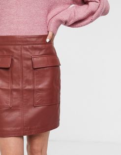 Femme leather mini skirt with pocket detail in red