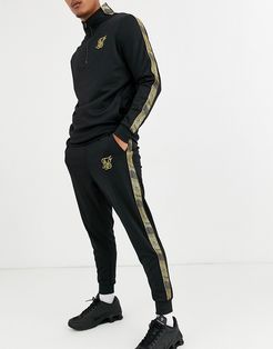 skinny sweatpants in black with gold logo
