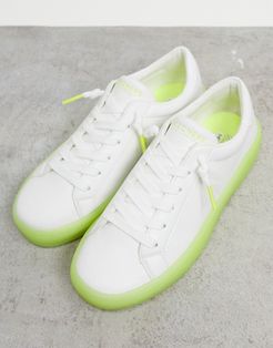 lace up sneakers in white with green sole