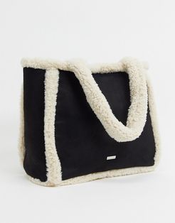 sherpa trimmed tote bag in black and cream
