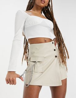 asymmetric buckle detail mini skirt in white
