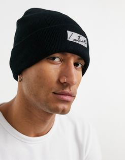 essentials beanie with rubber patch in black