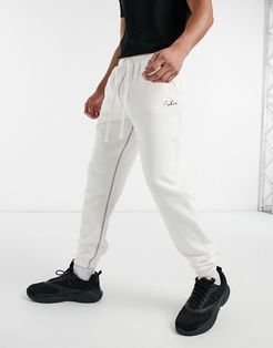 pocket signature sweatpants in off white-Cream