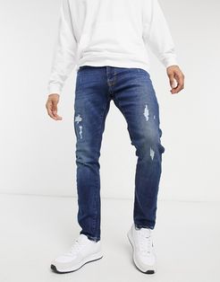 alister skinny jeans in dark wash-Blues