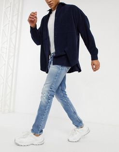 scanton slim fit distressed jeans in clint ten year light wash-Blues