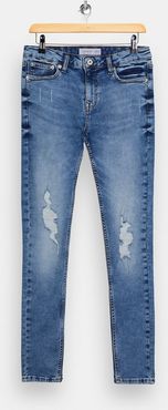 ripped super spray on jeans in mid wash-Blues