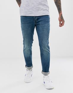 slim jeans in mid wash blue