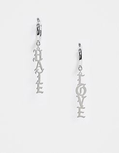 asymmetric earrings in silver with 'Love Hate' slogan