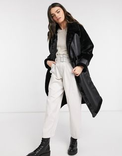 longline oversized faux fur coat with paneled detail in black