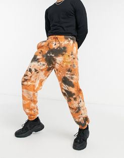 sweatpants with 'peace' print in brown tie dye