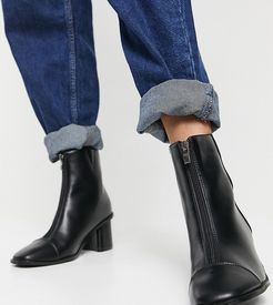 heeled boots with zip detail in black