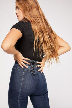 CRVY Super High-Rise Lace-Up Flare Jeans by We The Free at Free People, Worn Dark, 24