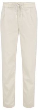 HUGO BOSS - Tapered Fit Pleat Front Pants With Drawstring Waistband - Light Beige