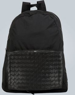 Backpack with intrecciato panel
