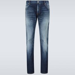 Slim-fit distressed jeans