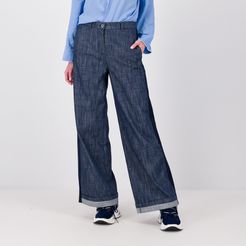 Pantaloni jeans con inserto e risvolto al fondo