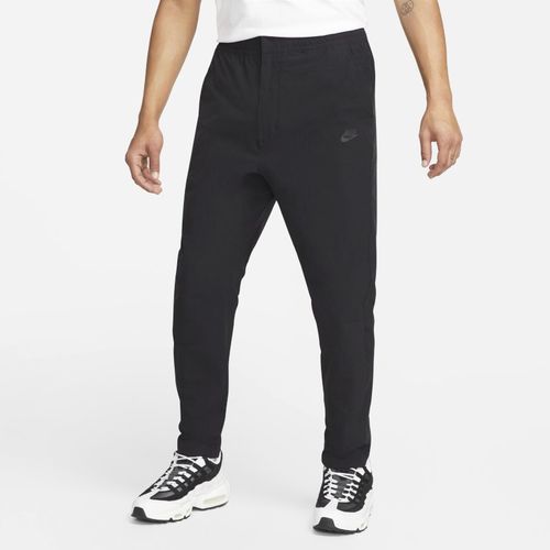 Pantaloni commuter in tessuto Nike Sportswear – Uomo - Nero