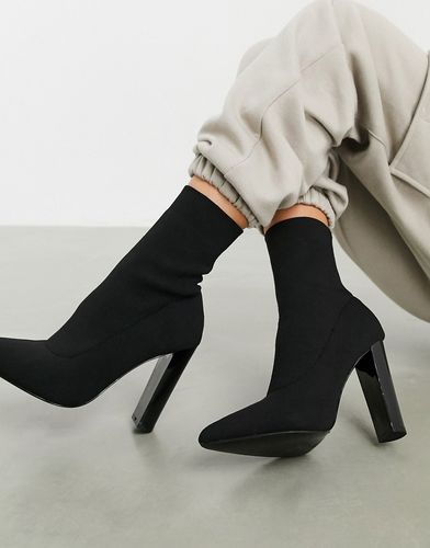 Enhance block heel sock boots in black knit