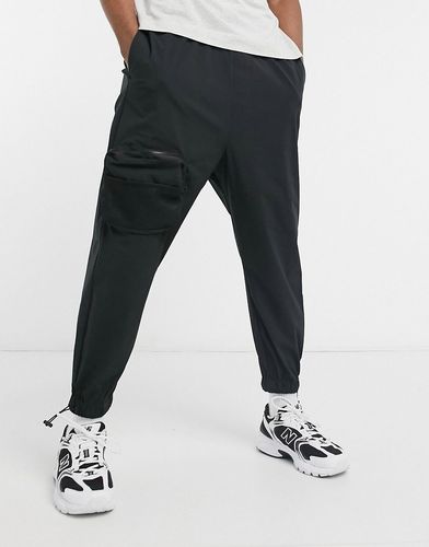 oversized tapered sweatpants with cargo pockets in black