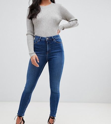 ASOS DESIGN Petite Ridley high waisted skinny jeans in dark stone wash with raw hem detail-Blues