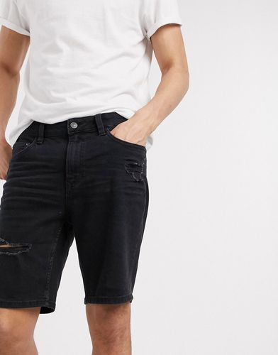 denim shorts in skinny fit with rips in black