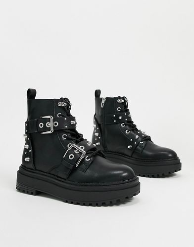 stud and buckle detail boots in black