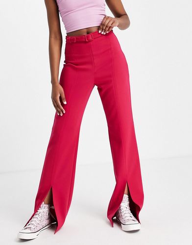 Pantaloni sartoriali a vita alta con spacchi sul davanti rosa in coordinato