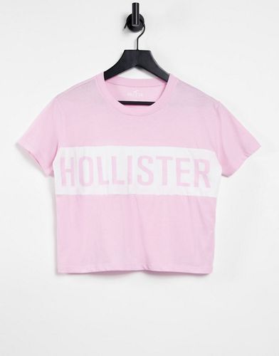 T-shirt in rosa con logo a fascia