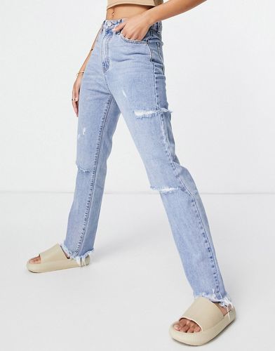 Jeans a vita alta con strappi sulla coscia blu chiaro
