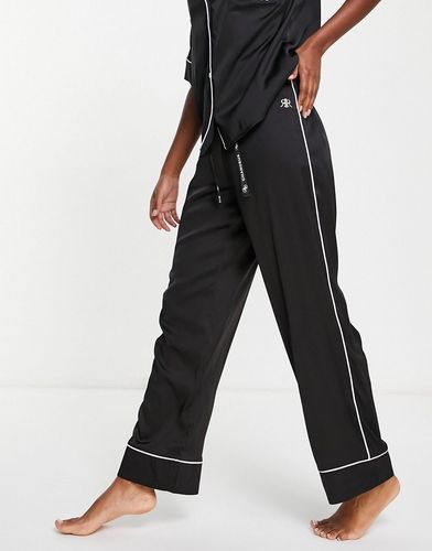 Pantaloni del pigiama in raso nero con logo a contrasto